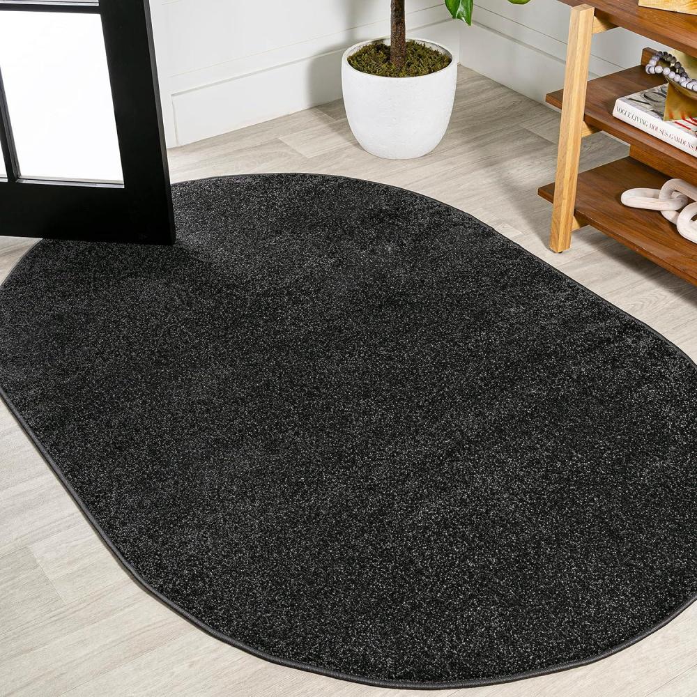 imageJONATHAN Y Haze Solid LowPile Black 3x5 Oval Indoor Area Rug CoastalBohemianMinimalistClassic EasyCleaning for Living RoomBedroomKitchenPet FriendlyNonShedding SEU100I3OV