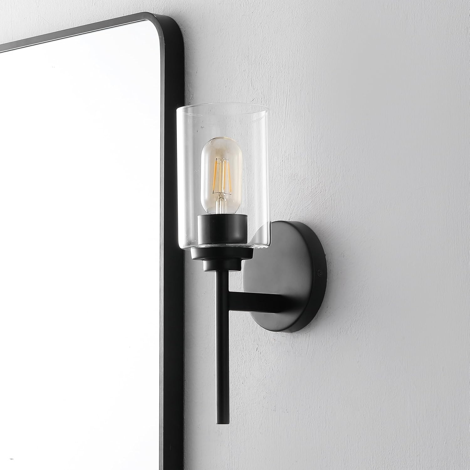 image:imageJONATHAN Y 13 Black Clear 1Light Metal Cylinder Wall Sconce Farmhouse Industrial Modern Indoor Lighting for Hallway Bathroom with Glass Shade LED Bulb Included JYL9547DBlack